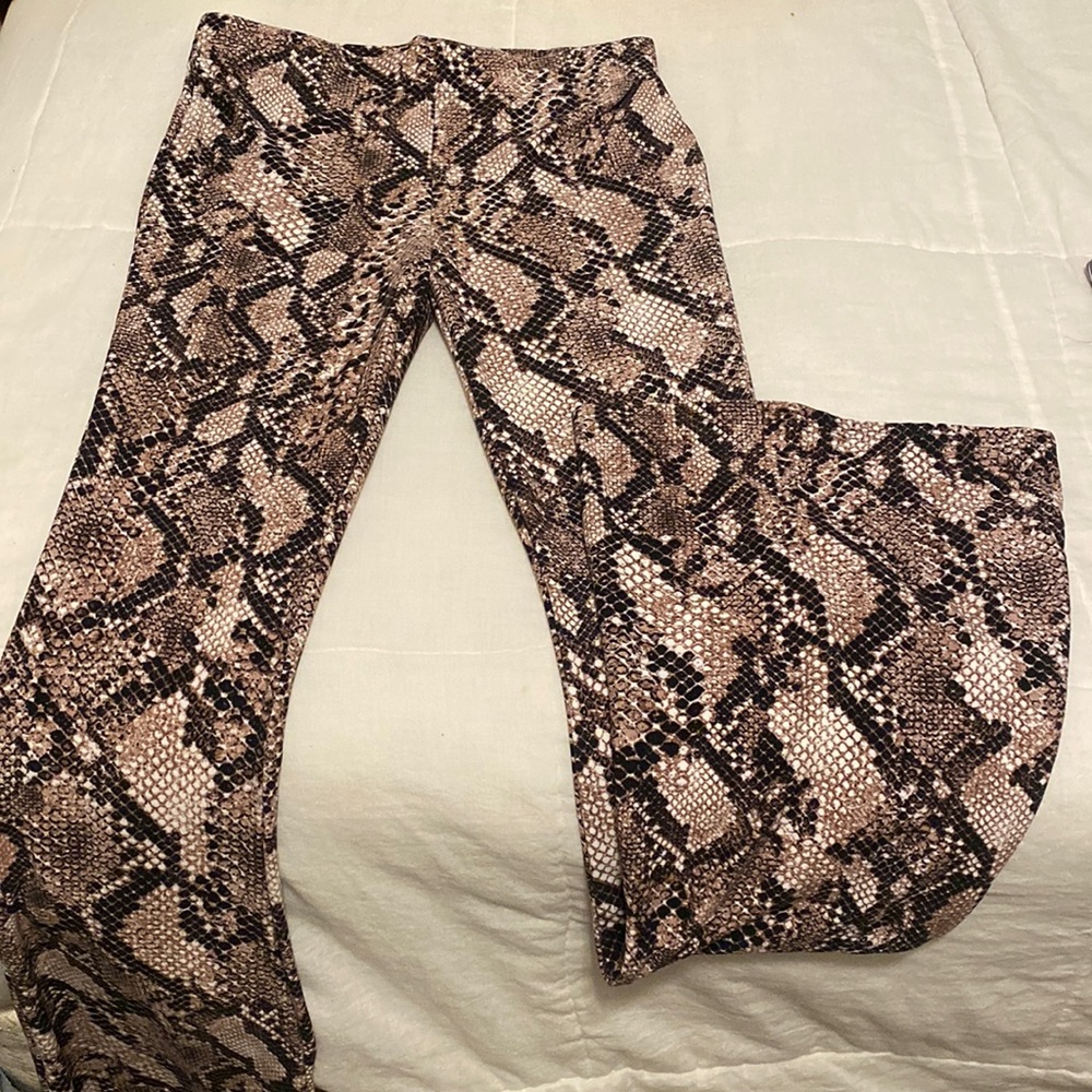 Stretchy pants, bottoms flare out